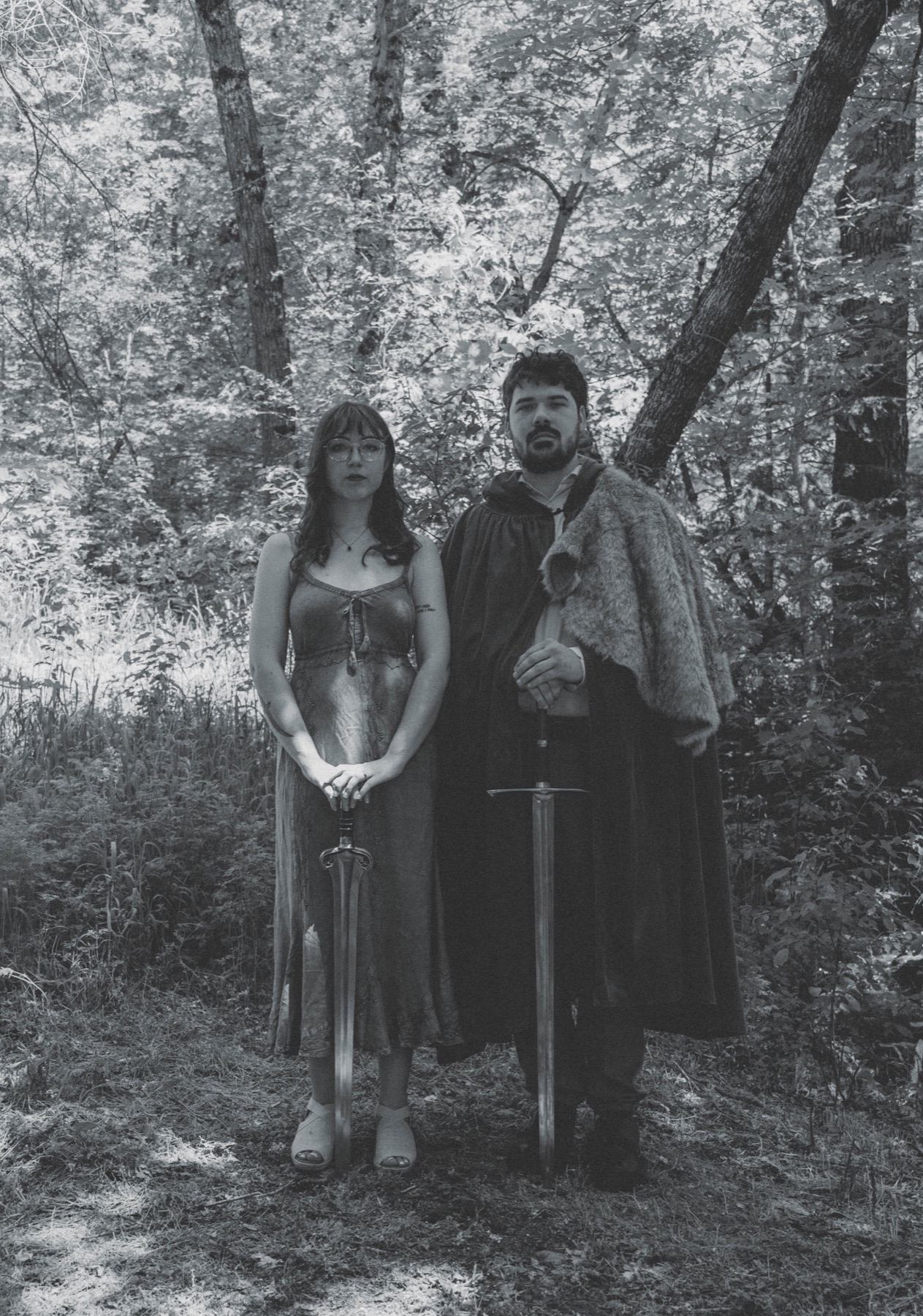 The artists behind AV Therapy standing together in the woods